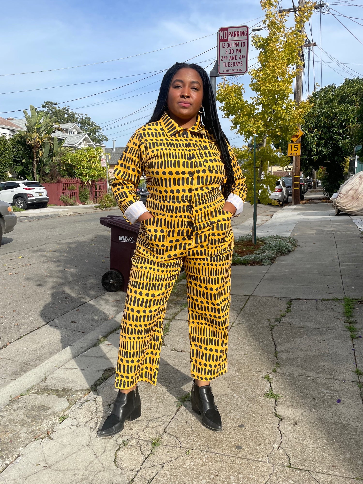 Black woman wearing nooworks x dorcascreates jumpsuit